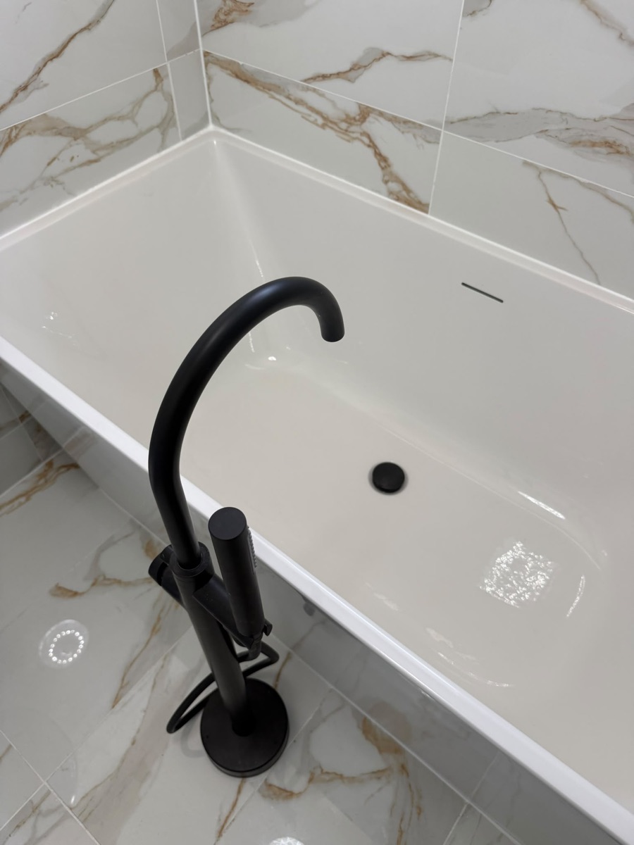 Freestanding matt-black bath filler tap fitted by LR Heating