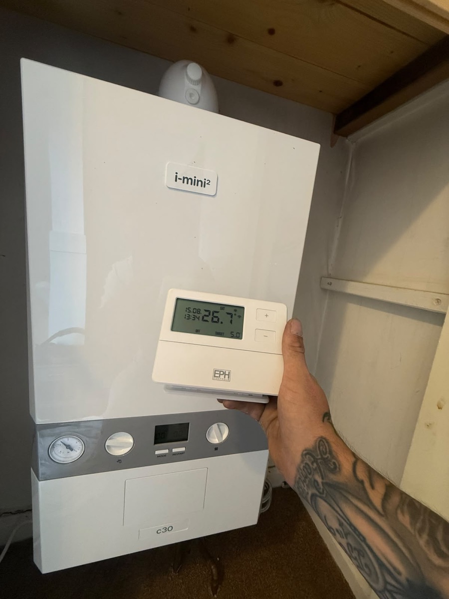 LR Heating branded room thermostat with a newly installed Ideal i-mini combi boiler