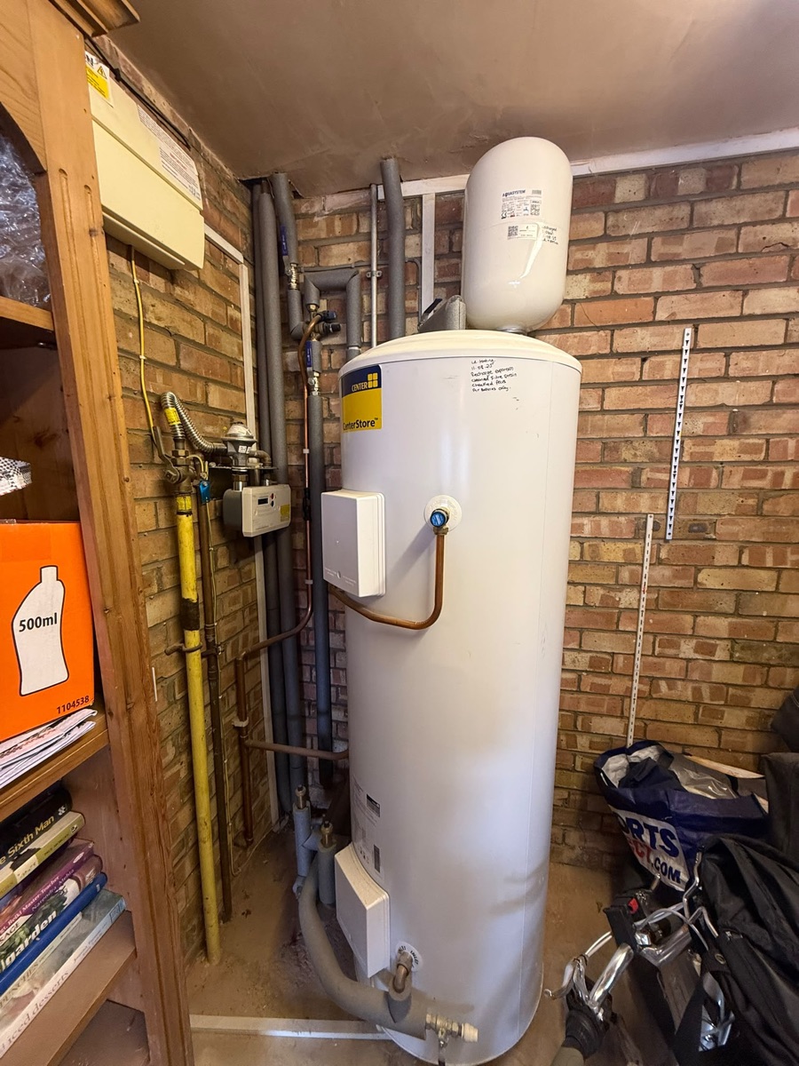 Annual check on an unvented indirect cylinder fitted by LR Heating two years earlier — external expansion vessel keeping the footprint compact